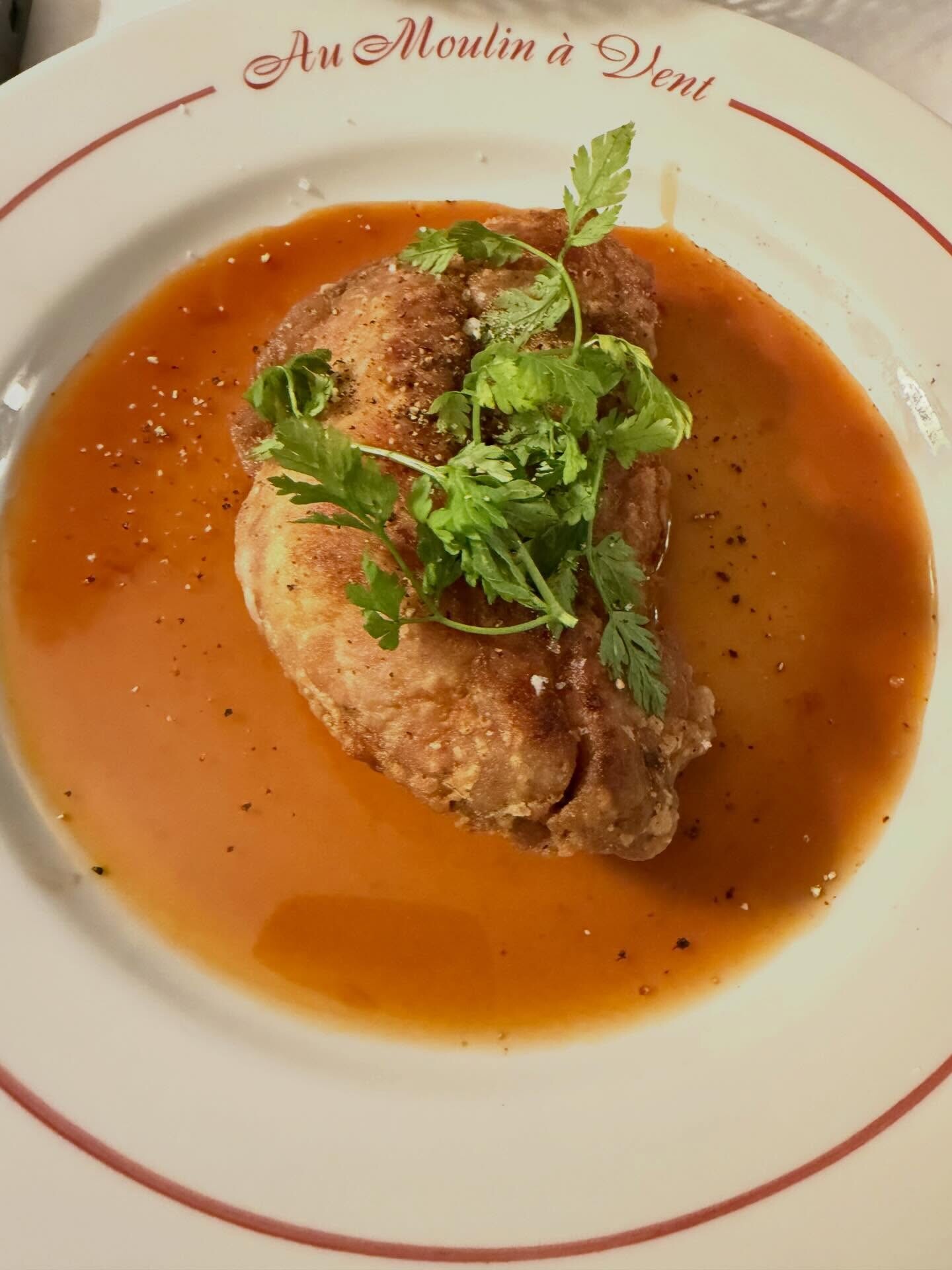 Un plat servi à Au Moulin à Vent.